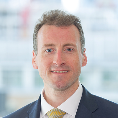 Headshot of Patrick O'Sullivan smiling at the camera.