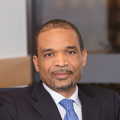 Headshot of Akan Oton looking at the camera.