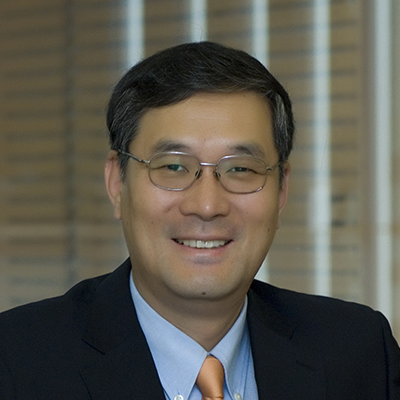 Headshot of John Park smiling at the camera.
