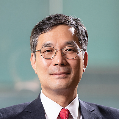Headshot of John Park smiling at the camera.