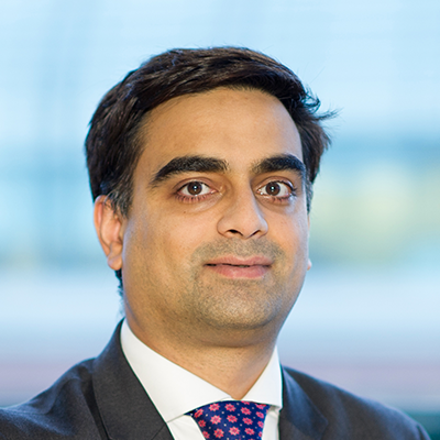 Headshot of Alay Patel smiling at the camera.
