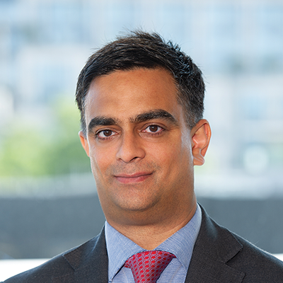 Headshot of Alay Patel smiling at the camera.