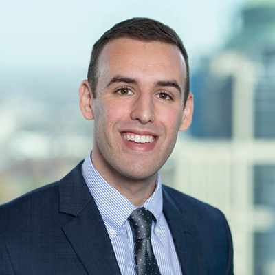Headshot of Alex Perez smiling at the camera.