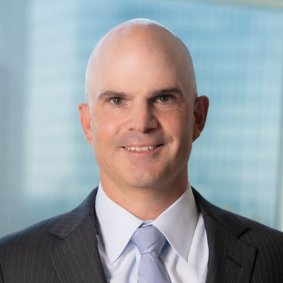 Headshot of Brian Pacheco smiling at the camera.
