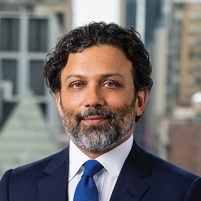 Headshot of Sumit Sasidharan similing at the camera.