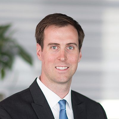 Headshot of Adam Schauer smiling at the camera.