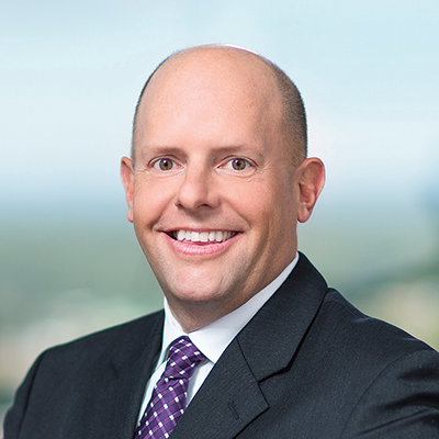 Headshot of Scott Simler smiling at the camera.