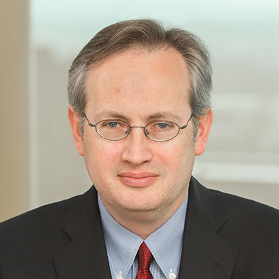 Headshot of Tony Soldi smiling at the camera.