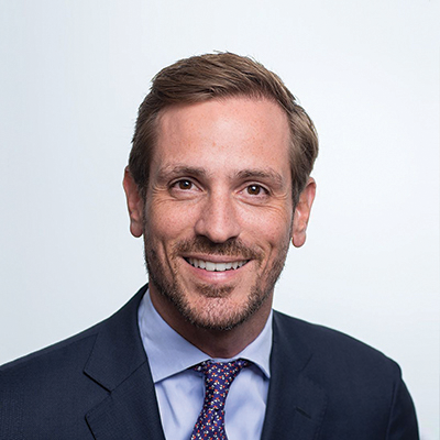 Headshot of Sascha Speckter smiling at the camera.