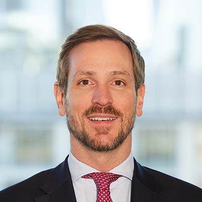 Headshot of Sascha Speckter smiling at the camera.