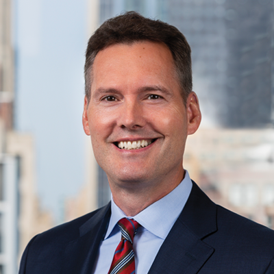 Headshot of George Stone smiling at the camera.