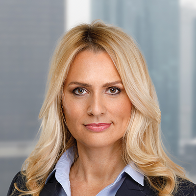 Headshot of Heike Tajariol smiling at the camera.