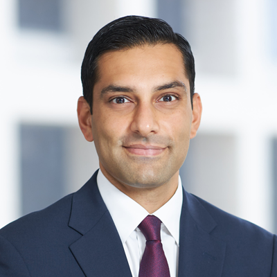 Headshot of Karan Talwar smiling at the camera.