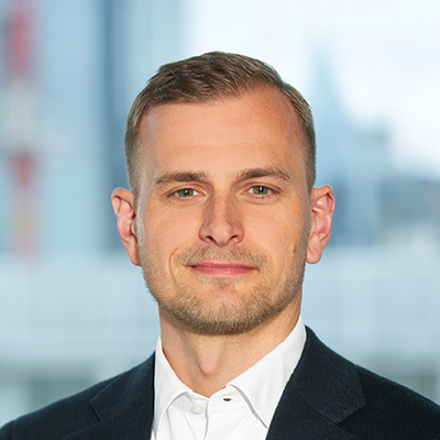 Headshot of Nikolas Von Kleist smiling at the camera.