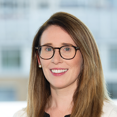 Headshot of Orla Walsh smiling at the camera.