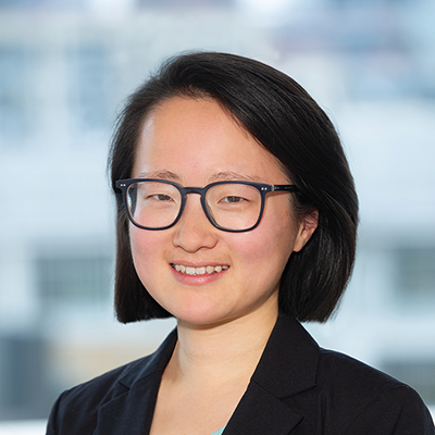 Headshot of Ruolin Wang smiling at the camera.