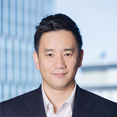 Headshot of Chris Yoo smiling at the camera.