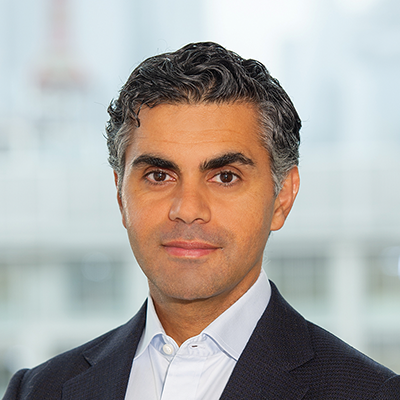 Headshot of Waleed Zamel looking at the camera.