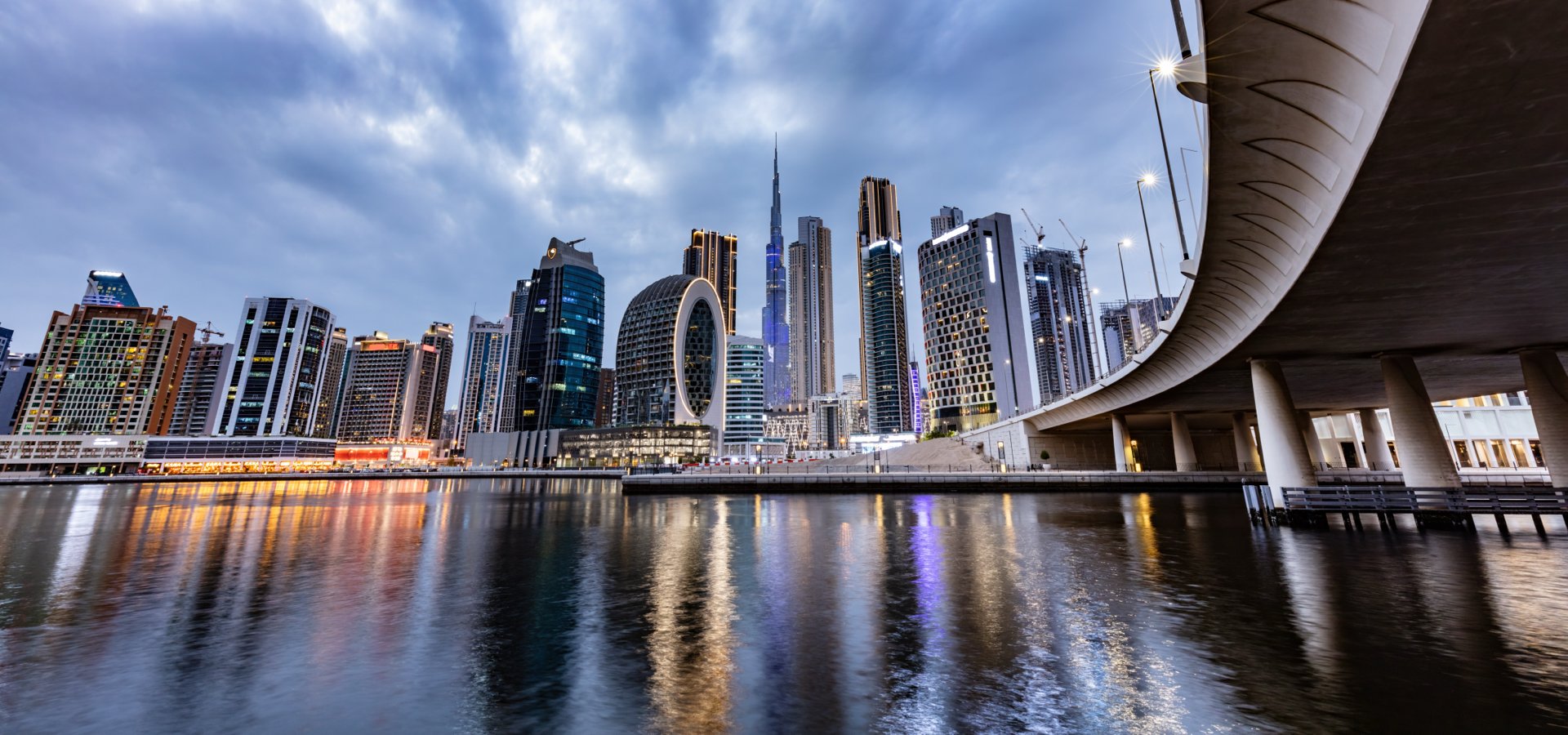 Skyscrapers skyline of Dubai UAE downtown with Burj Khalifa at night.
