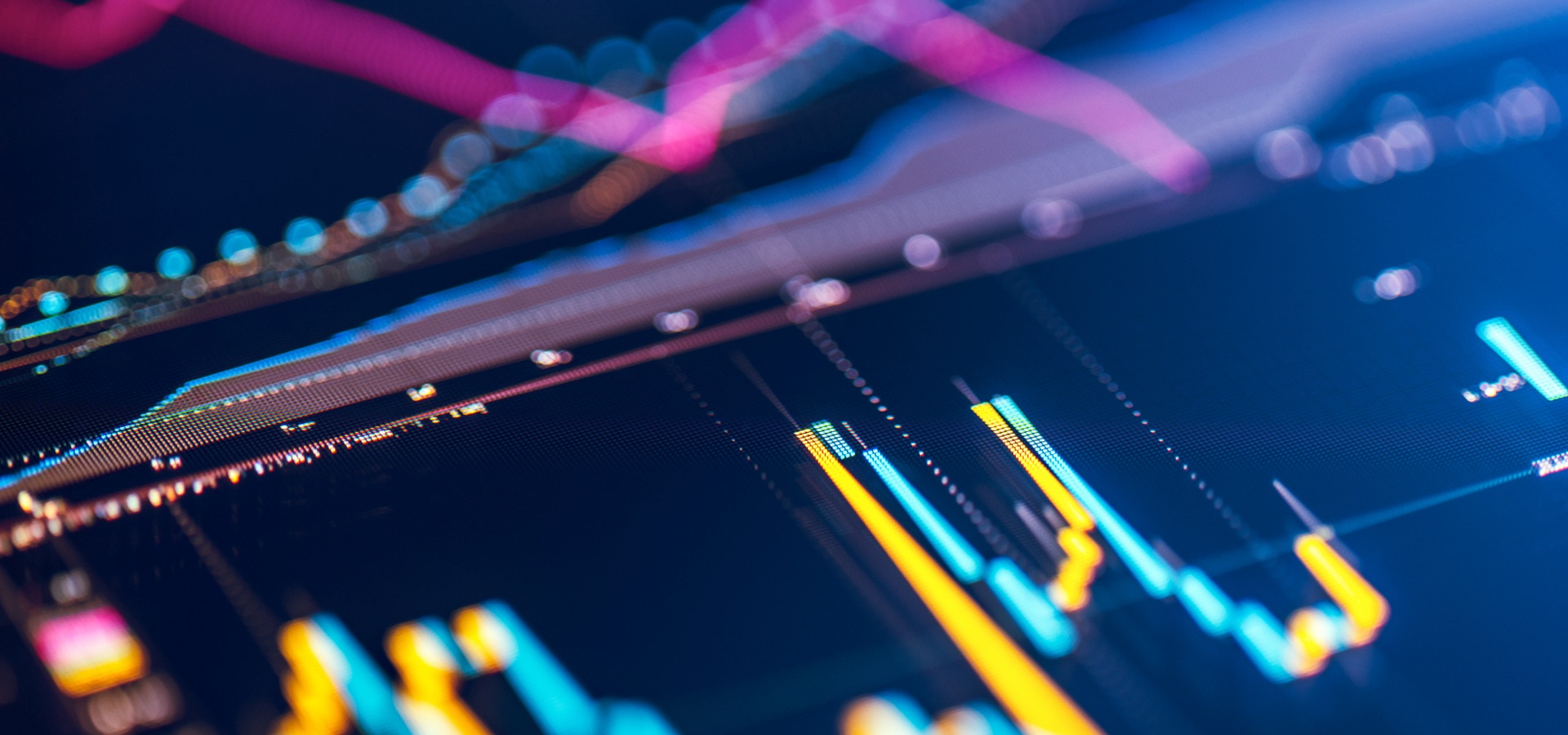 Close‑up of a digital market chart with colorful bars and trend lines representing financial performance and market movement.