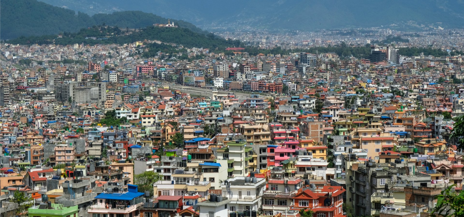 Emerging market city with mountains. 