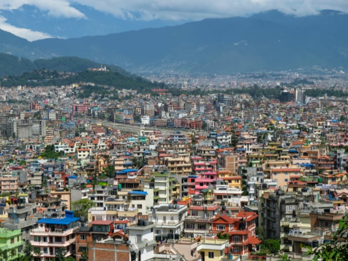 Emerging market city with mountains. 