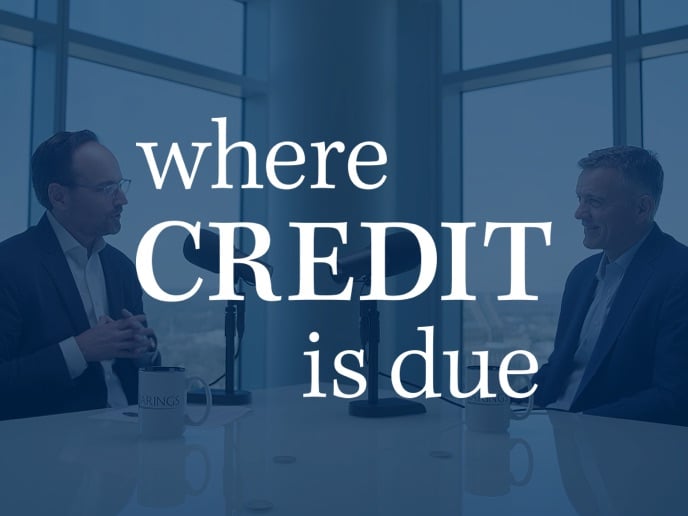 Two people recording a podcast.