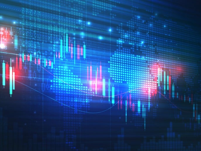 Digital financial chart overlaid on stacks of coins, representing data‑driven investing and financial growth.