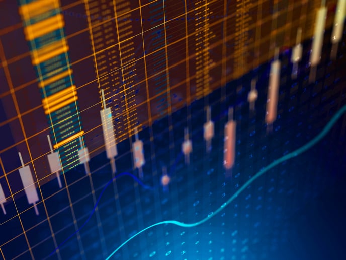 Abstract financial markets composition featuring contrasting blue and orange grids, line charts and bar charts.