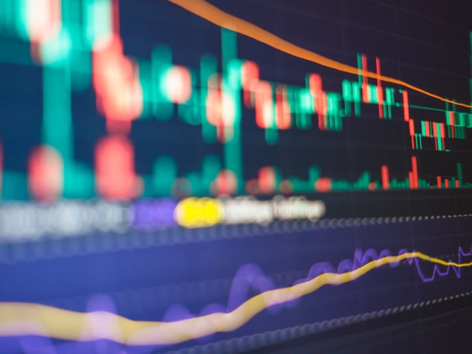 Abstract financial markets composition featuring contrasting teal, red, purple and yellow bar chart shapes.