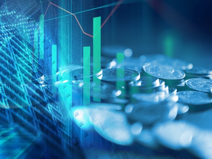 Digital financial chart overlaid on stacks of coins, representing data‑driven investing and financial growth.
