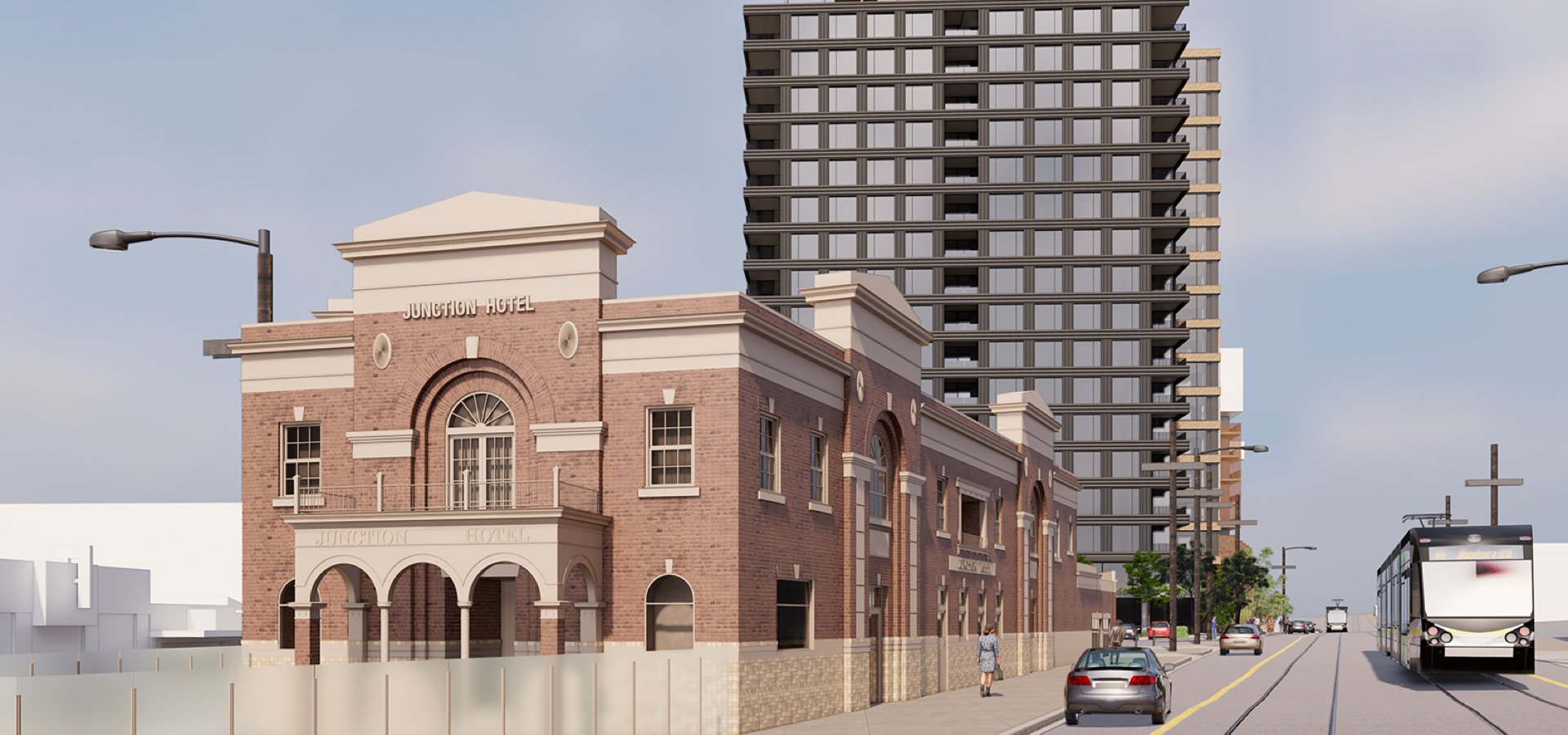 A hotel and residential building with a few cars driving on the road.