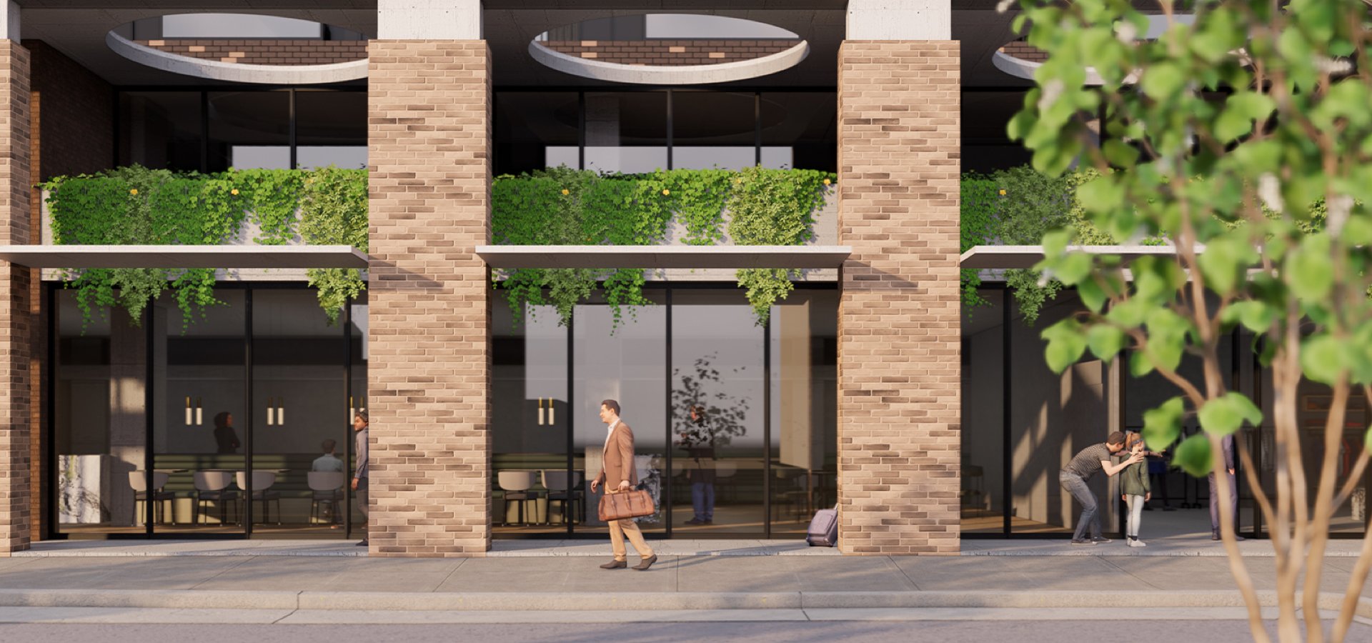 A building with a glass door and a couple of people walking.