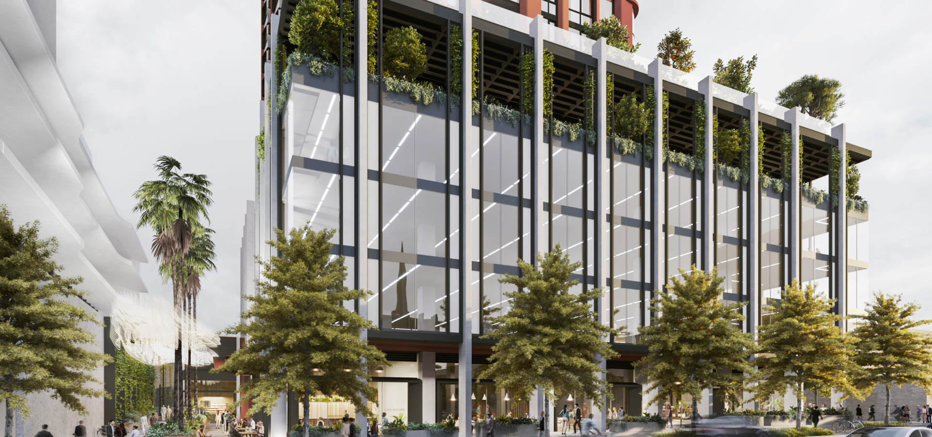 A residential building with trees and glass windows.