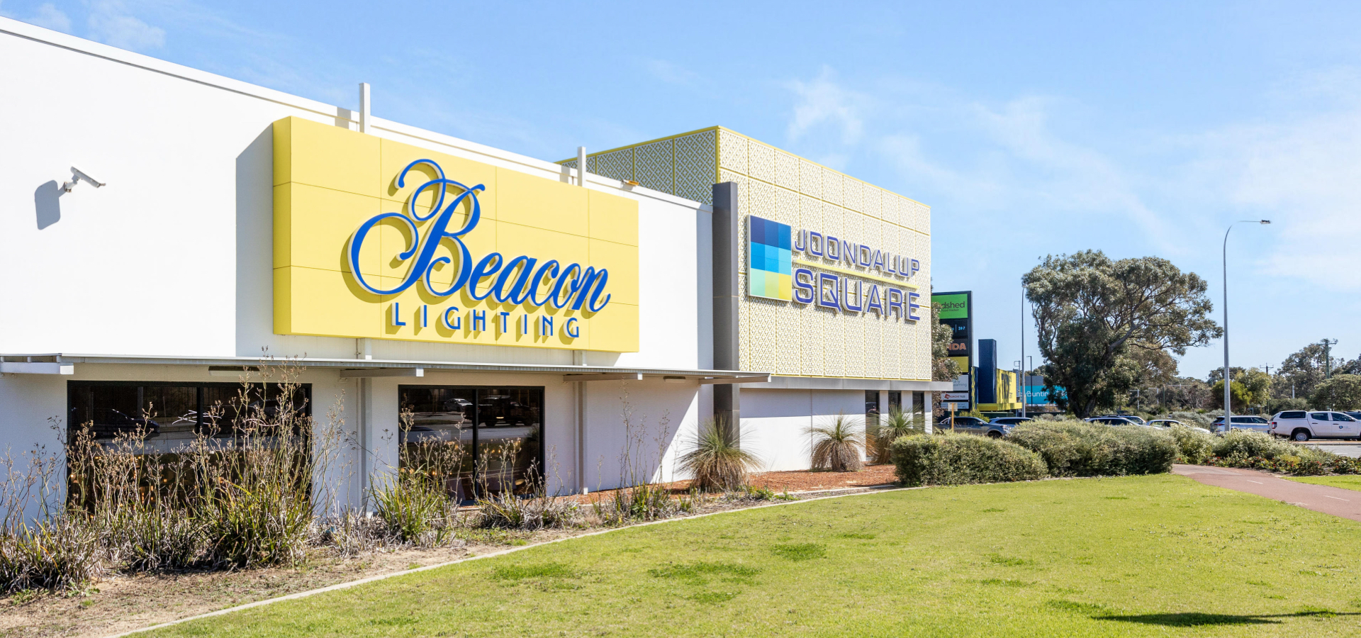 A building with a sign "Beacon Lighting" and "Joondalup Square" on it.