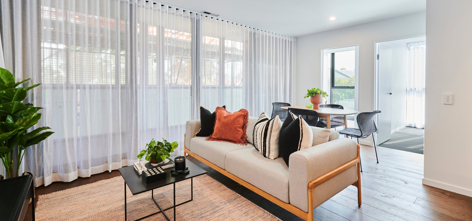A living room with a couch and a table.