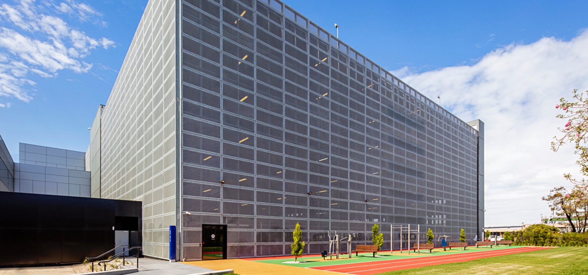 A large parking deck with outdoor workout space.