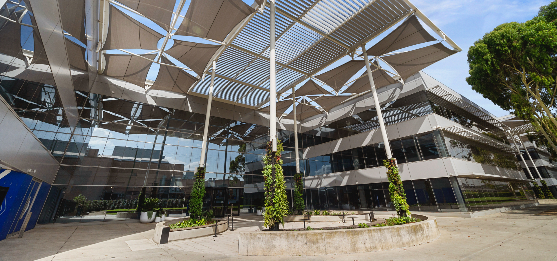 A building with a roof covered with glass windows.